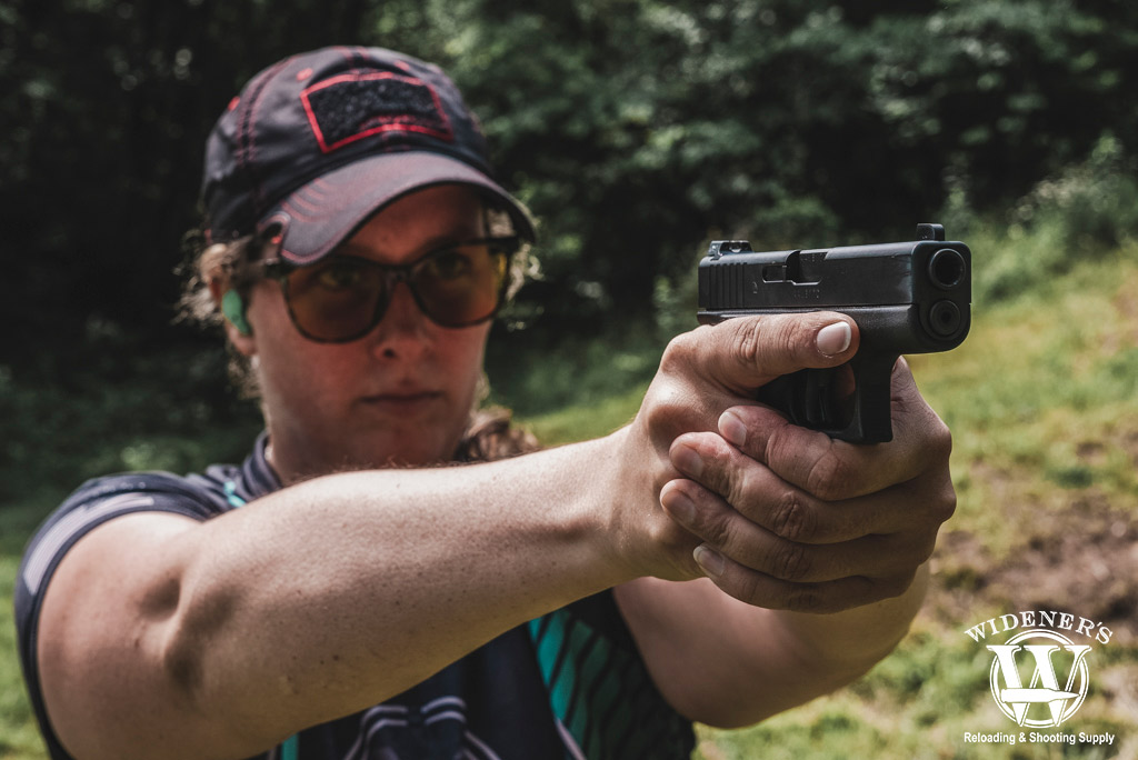 a woman shooting a subcompact handgun at the range a photo of a woman shooting a subcompact handgun at the range