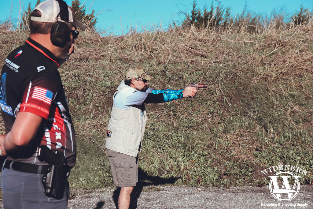 man shooting at an idpa competition a photo of a man shooting at an idpa competition