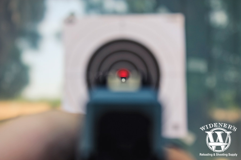 looking down the sights of a pistol at a target a photo looking down the sights of a pistol at a target