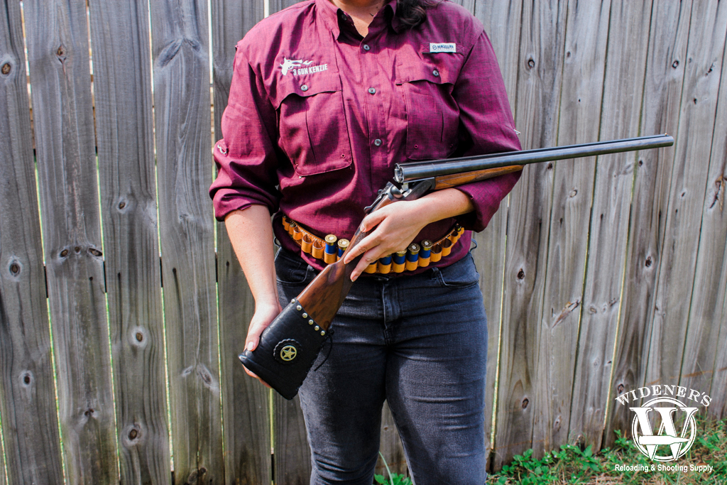 a female competition shooter with a side by side shotgun a photo of a female competition shooter with a side by side shotgun