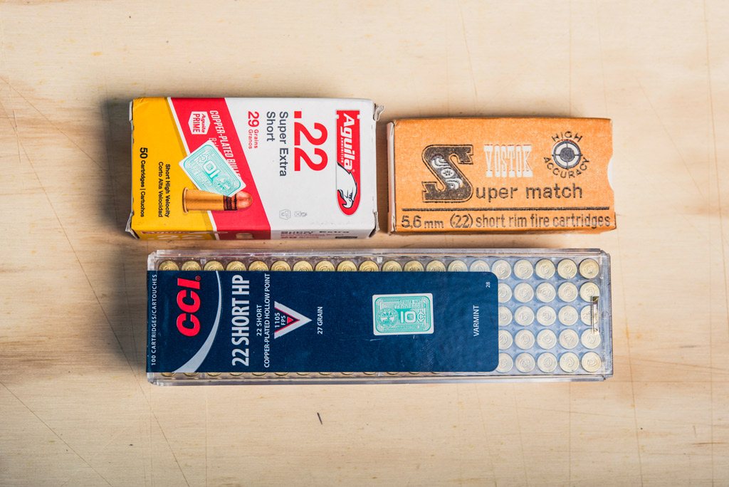 photo of boxes of 22 short ammo on plywood