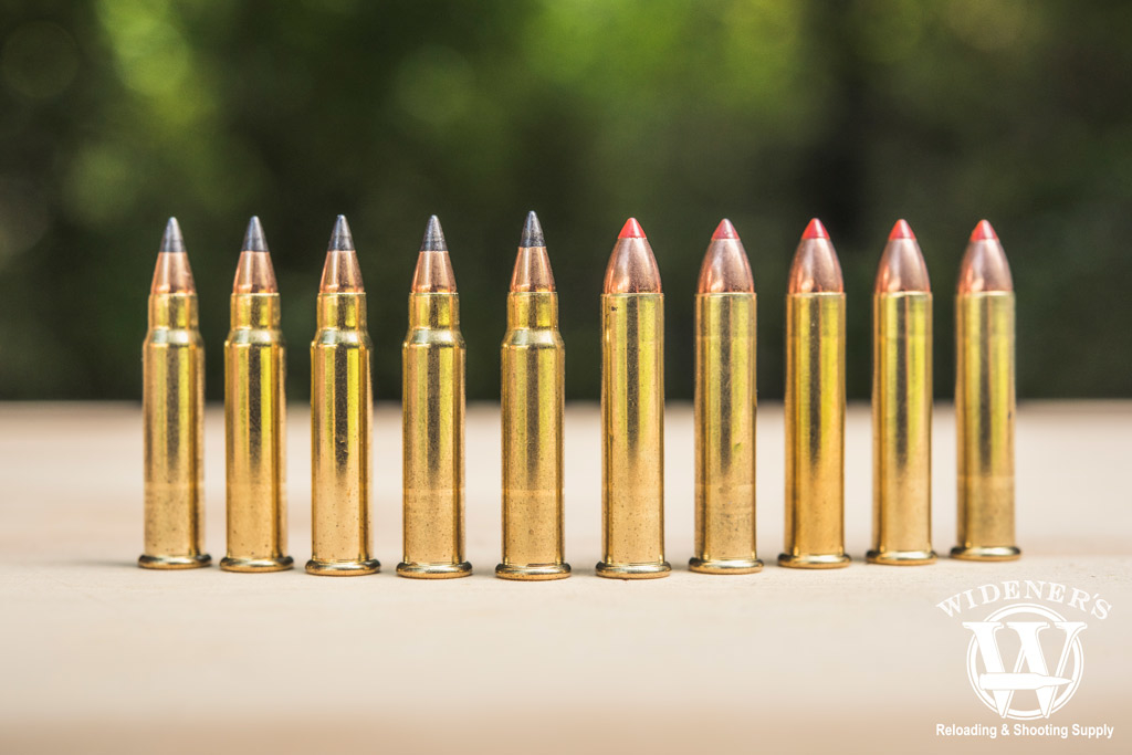 17 HMR bullets next to 22 magnum bullets photo of 17 HMR bullets next to 22 magnum bullets outdoors