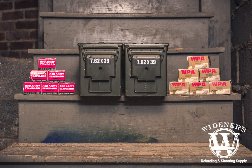 7.62x39 ammo boxes and 50 cal ammo storage boxes stored in a basement photo of ammo boxes and 50 cal ammo storage boxes stored in a basement