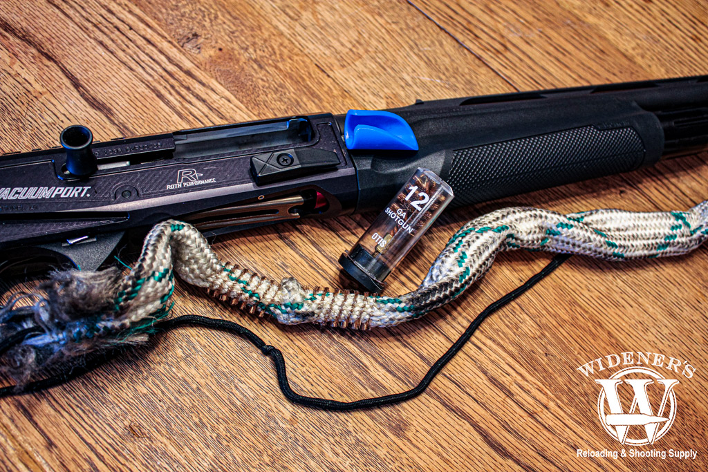 a shotgun ready for cleaning a photo of a shotgun ready for cleaning