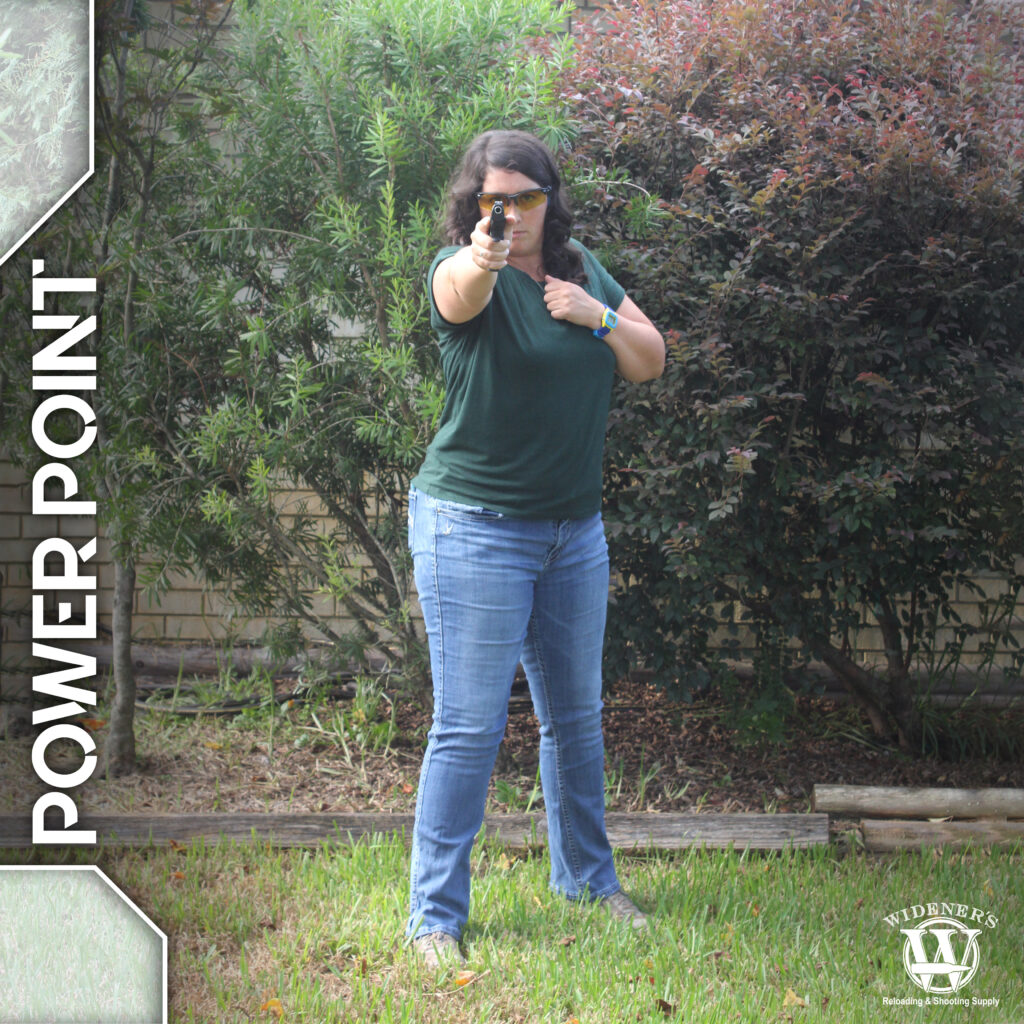 a female shooter demonstrating power point stance photo of a female shooter demonstrating power point stance