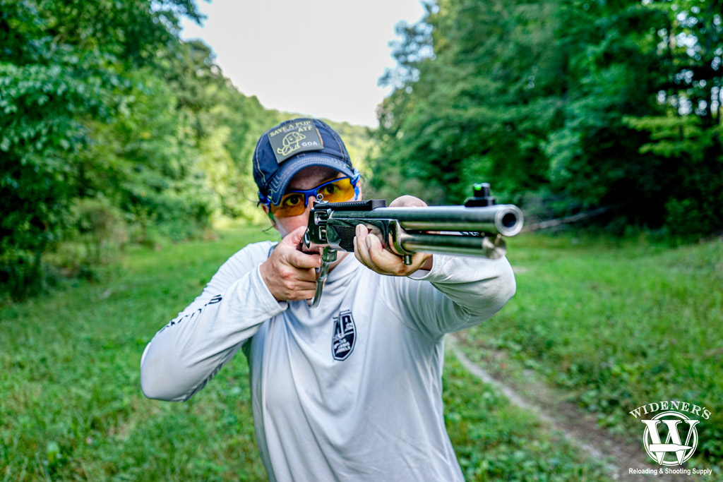 female shooting a lever action rifle a photo of a female shooting a lever action rifle