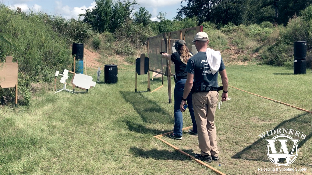 competition shooting female at the gun range photo of competition shooting female at the gun range