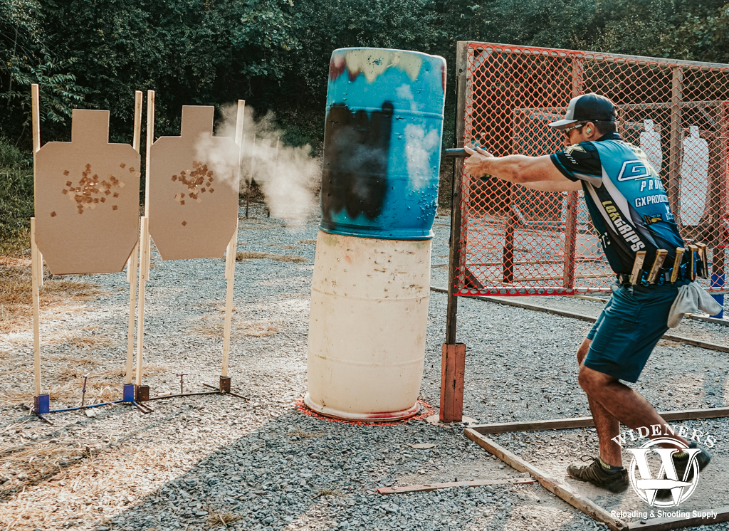 a man shooting a uspsa match a photo of a man shooting a uspsa match