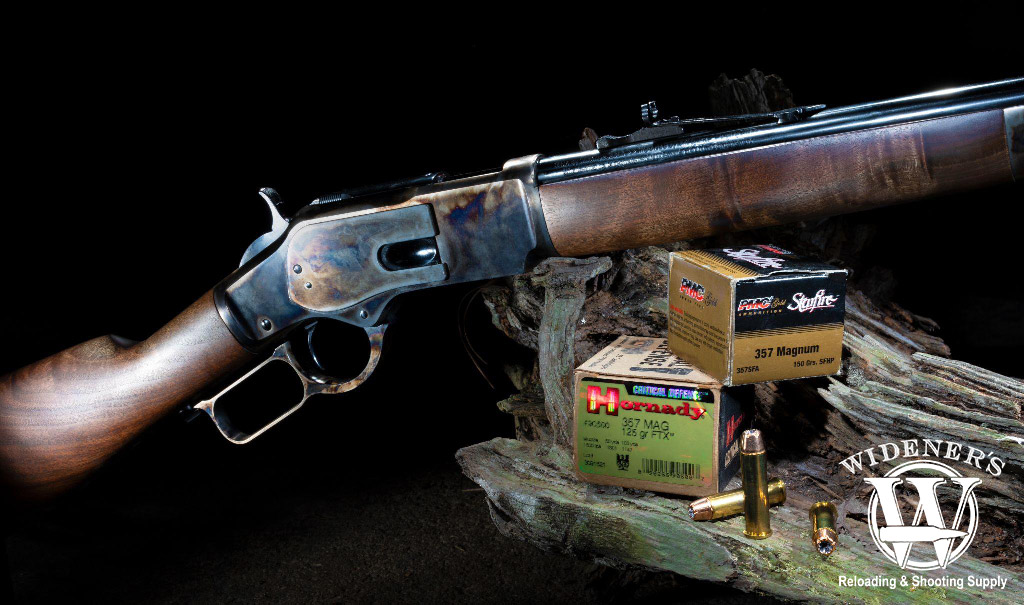 a photo of a lever gun and ammo