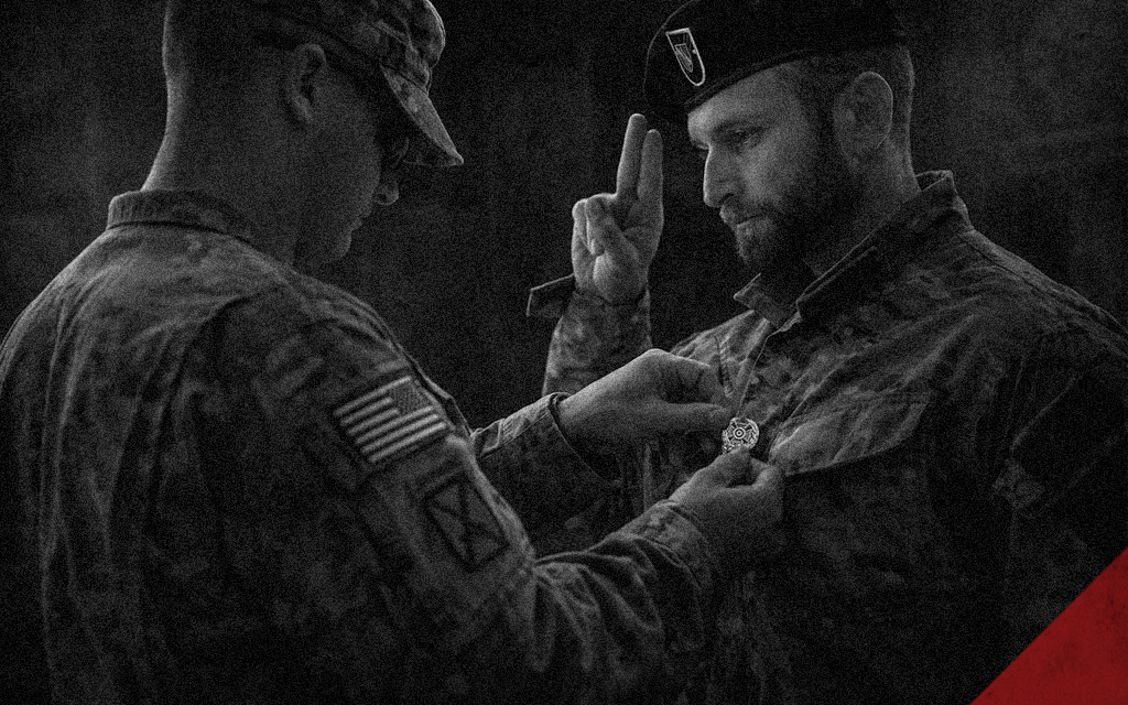 a photo of a soldier receiving army marksmanship badges