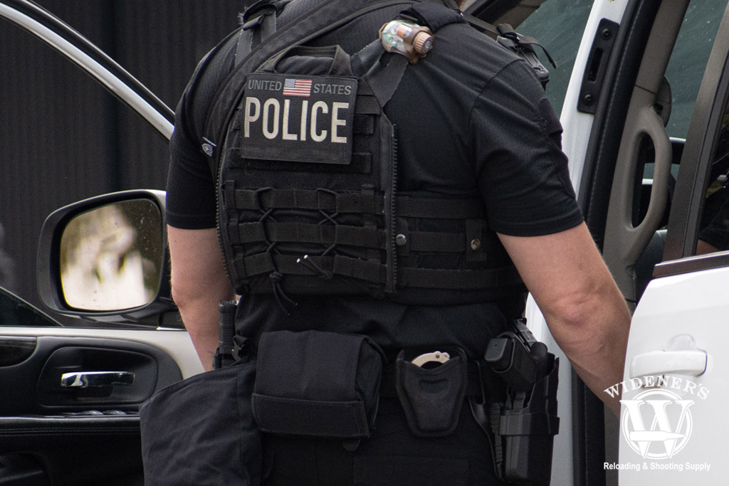 a police officer wearing a plate carrier a photo of a police officer wearing a plate carrier