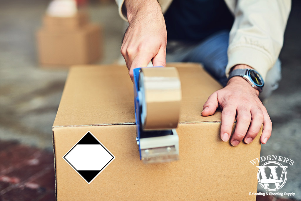a photo of a man shipping a box full of ammo